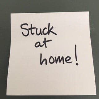 Post-it note with "Stuck at Home!" written on it.