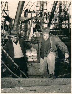 Home at last. Manuel F. Sylvia, cook on the 'Moonlight' arriving at State Pier in New Bedford after being lost at sea, without power, for 36 hours. Contributor: David A. Sylvia.