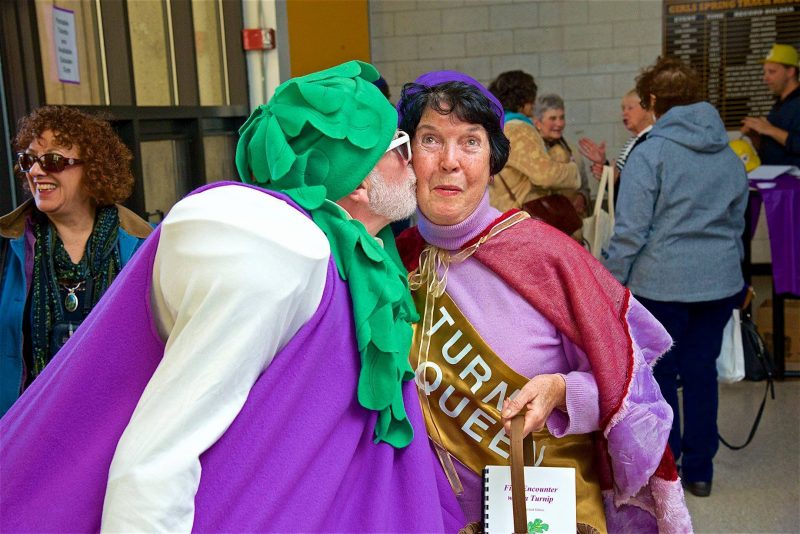 Turnip Queen 2013 is greeted by her most devoted fan. Photo taken by Anton Anderson. Pictured, from left to right: Jack Kerig and Kaye Richardson. Location: Eastham Turnip Festival at Nauset Regional High School.