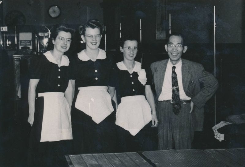  My father and his staff Description 'My father owned the Jade Restaurant in Malden. He purchased it during WWII and expanded it. He had several wait staff and kitchen staff. Pictured, from left to right: Maude McKenzie, the wait staff at Jade Restaurant, my father Dun Shai Jeong. Location: Jade Restaurant.'