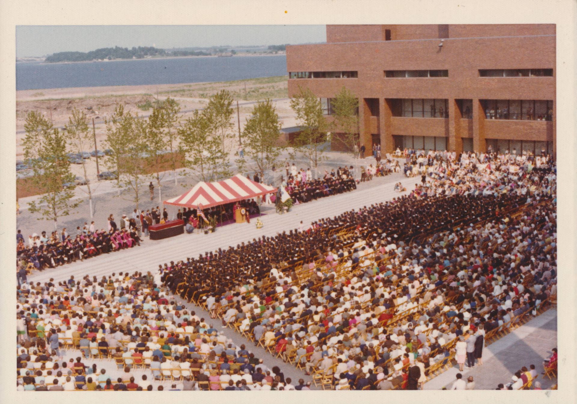 Color aerial photograph of commencement ceremony on UMass Boston's center plaza