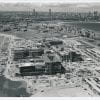 Black-and-white aerial photograph of the UMass Boston campus under construction