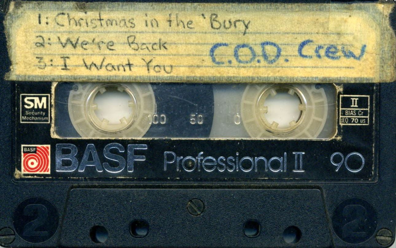 Front of cassette tape with C.O.D. Crew written on the label