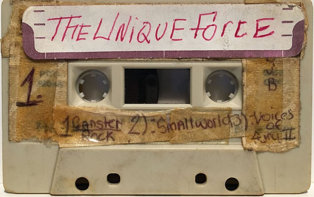 Front of cassette tape with The Unique Force written on the label
