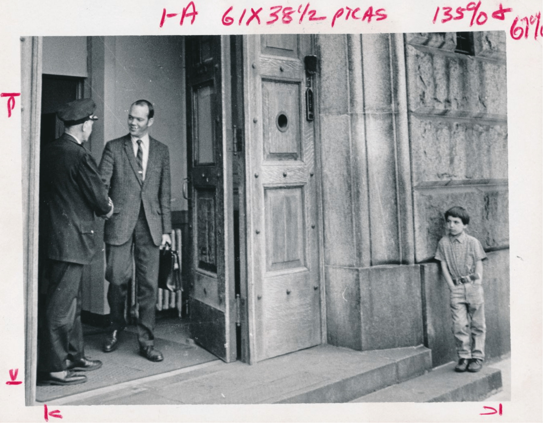 BTU President John Reilly leaves the Charles Street jail as a child looks on.