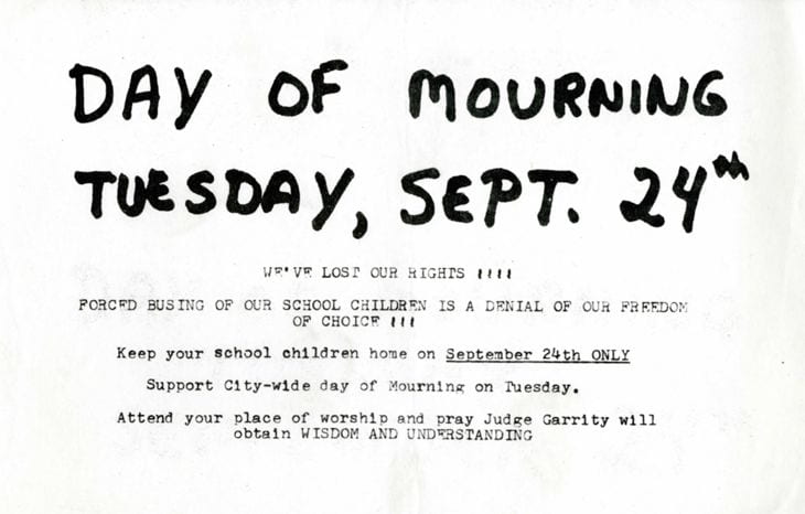 A flyer reading "Day of Mourning: Tuesday, Sept. 24th. We've lost our rights! Forced Busing of our School Children is a Denial of our Freedom of Choice! Keep your school children home on September 24th only. Support city-wide day of Mourning on Tuesday. Attend your place of worship and pray Judge Garrity will obtain wisdom and understand."