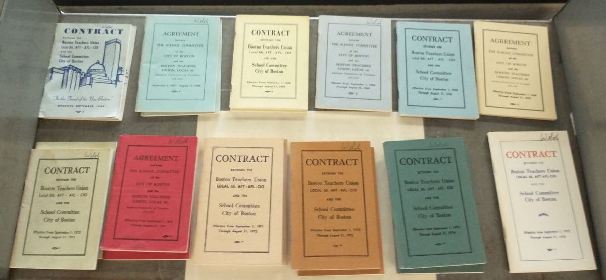 Twelve copies of BTU contracts on a library cart