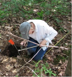Dr. Trigg examines a soil core sample