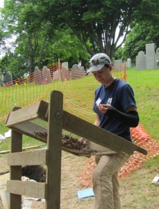 Working against the backdrop of the historic cemetery.