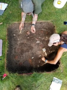 Overhead view of two students excavating.