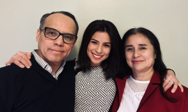 Doctoral student with her parents