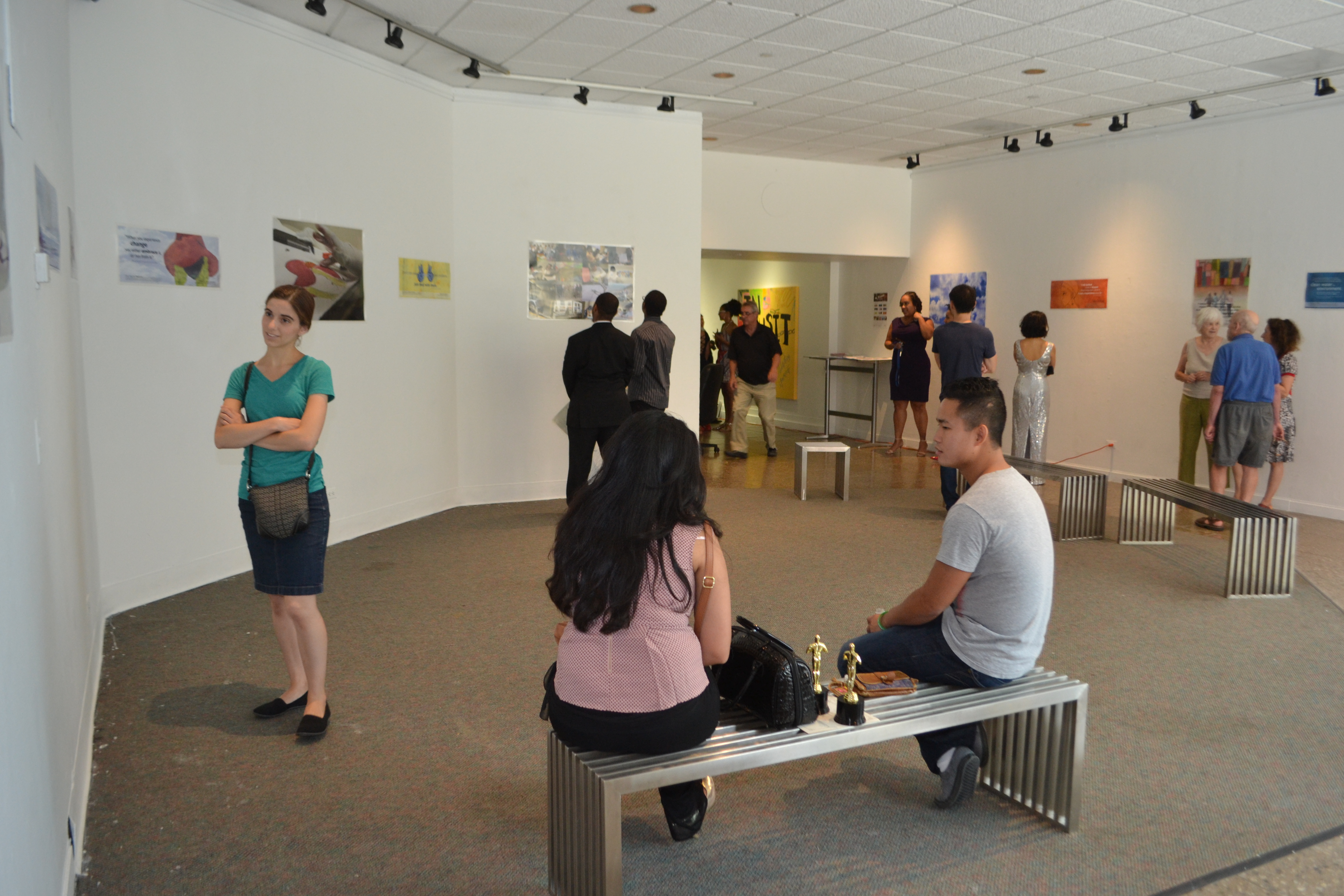 Visitors view posters in the Harbor Gallery. Photo by Colleen Locke.