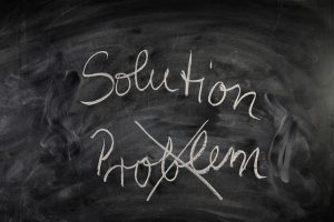 "Solution" written on blackboard