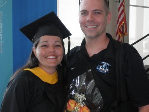 Georgianna Melendez poses at graduation with her husband