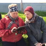 Guðný and Eric using an iPad