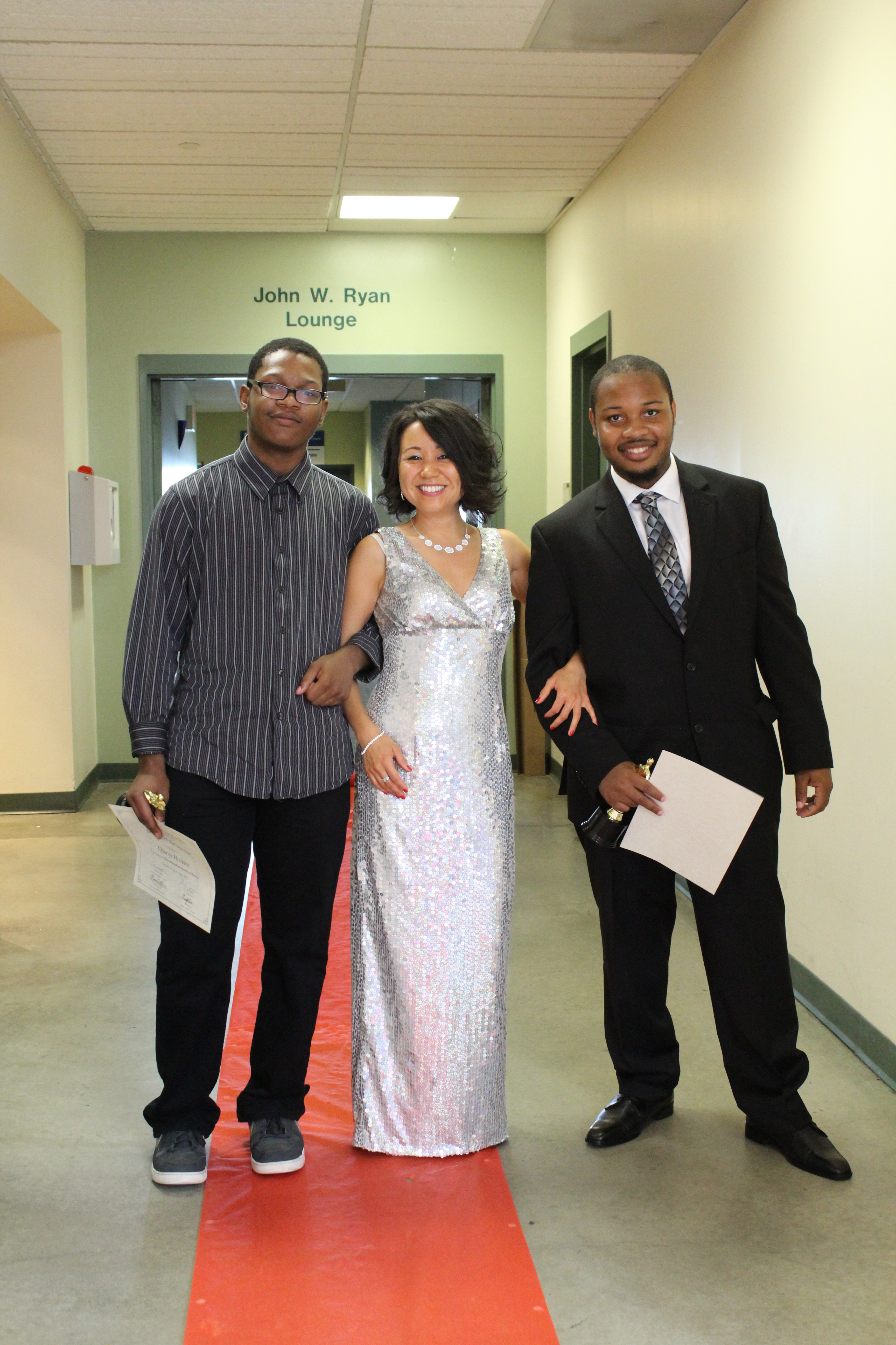 Merissa made a surprise entrance with her sparkling silver dress! She posed with her Urban Scholars students.