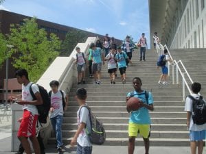 Students walking down the stairs. 
