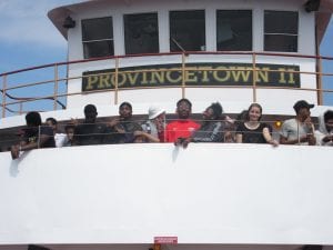 The scholars having fun at the top of the ship.