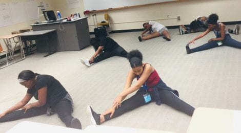 students are stretching pre-dance class
